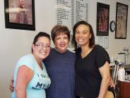 Left to right: Brandy (Jumy Nails employee), Carol (client of Jumy’s for 13 years), Jumy (owner)